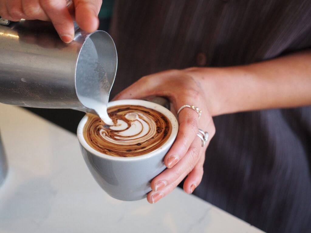 Sample Coffee Co. making cappuccino